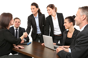 Picture of employees greeting one another