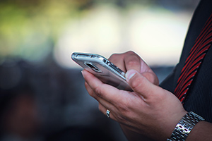 Picture of a person checking a phone