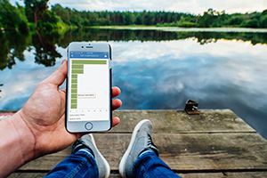 Using software while sitting at the dock of a lake