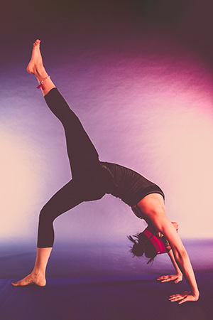 A dancer stretching upside down