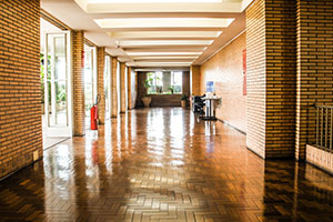 School hallway with hardwood floor